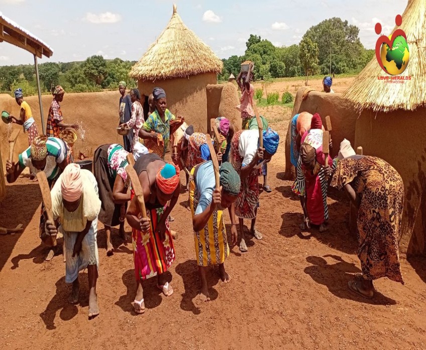 Community members involved in building a missions center for the community